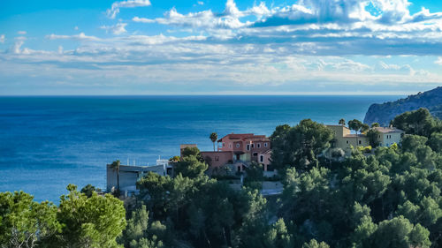 Panoramic view of sea and buildings against sky