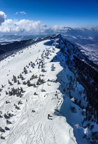 High angle view of snowcapped mountains against sky