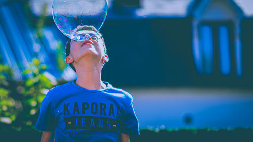Portrait of boy looking away outdoors