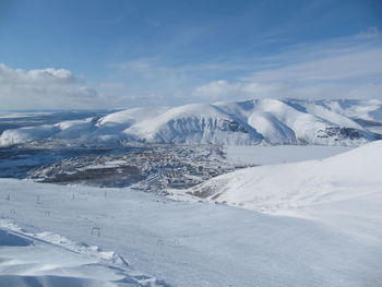 Scenic view of snowcapped mountains against sky