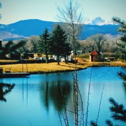 Scenic view of lake and mountains against sky