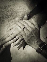 Close-up of hands holding leaf at home