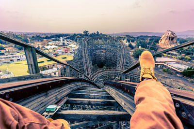 Low section of person on railing