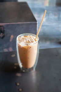 Close-up of coffee in glass on table