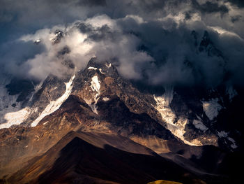 Aerial view of mountain range against sky