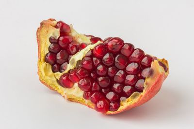 Close-up of strawberry cake against white background