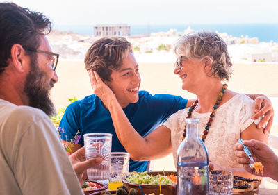 Family enjoying meal in balcony