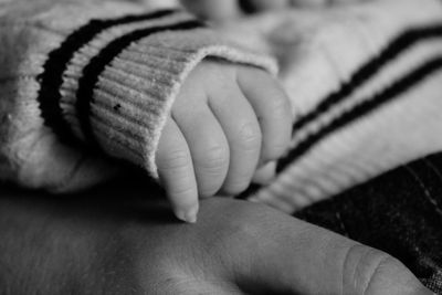 Cropped hands of father and baby