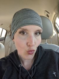 Portrait of man sitting in car