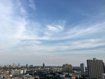 Buildings in city against sky