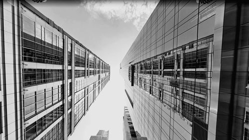 Directly below shot of modern buildings against sky