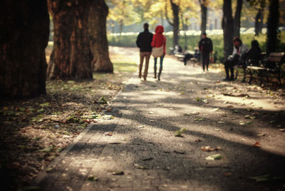 People on footpath at park