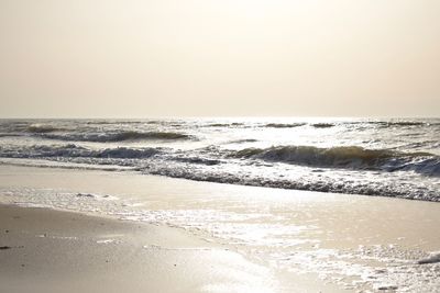 Scenic view of beach against clear sky