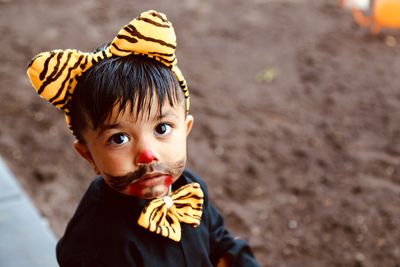 Close-up of cute boy with face paint