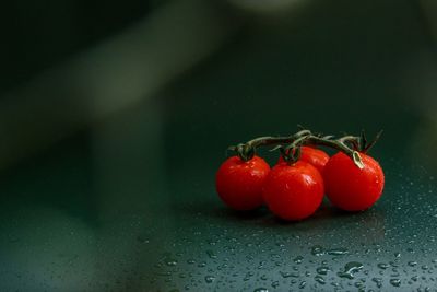 Close-up of red cherries on table