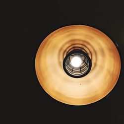 Low angle view of illuminated electric lamp