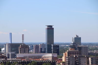 Buildings in city against sky