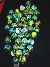 High angle view of candies on table against black background