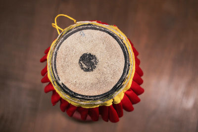 Directly above shot of person holding bread on table