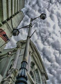 Low angle view of street light against building