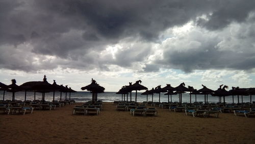 Scenic view of beach against sky during sunset