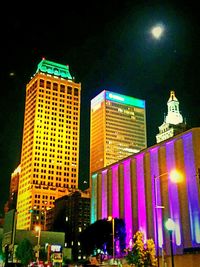 Low angle view of illuminated building at night