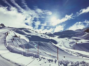 Scenic view of ski slope against sky