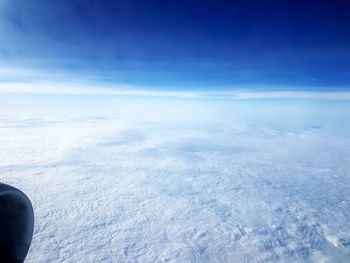 Aerial view of landscape against sky during winter