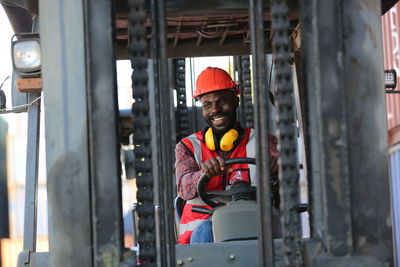 Side view of man working in factory