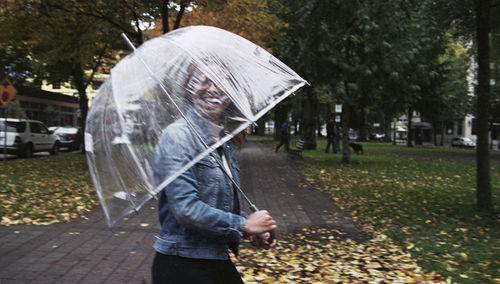Portrait of a smiling woman holding umbrella