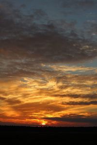 Scenic view of dramatic sky during sunset