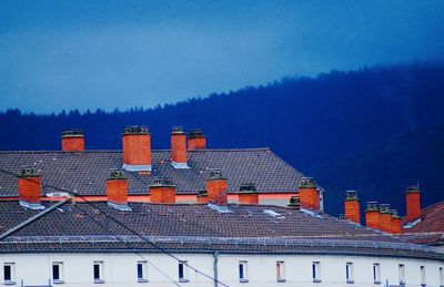 Houses against sky in city