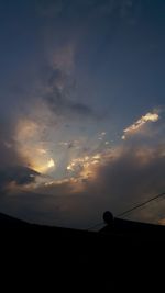 Low angle view of silhouette birds against sky during sunset