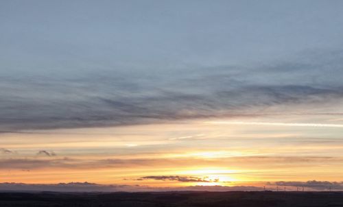 Dramatic sky over landscape during sunset