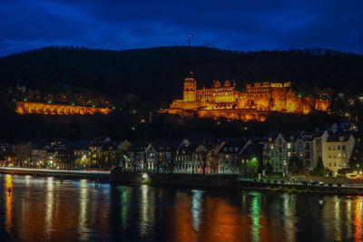 Illuminated buildings at waterfront