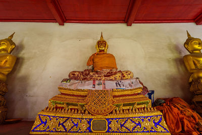 Buddha statue in temple outside building