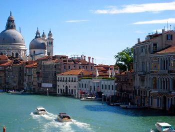 Old buildings along canal in venice