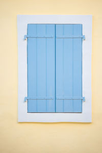 Closed blue window of building