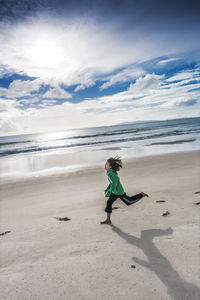 Girl running on beach