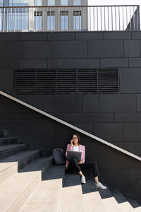 High angle view of people walking on staircase