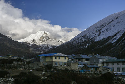 Island peak seen behind a village in nepal's khumbu valley.