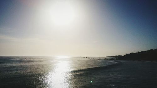 Scenic view of sea against clear sky during sunset