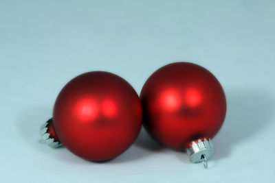 Close-up of tomatoes over white background