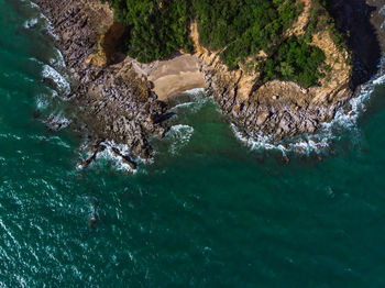 High angle view of rock formation in sea