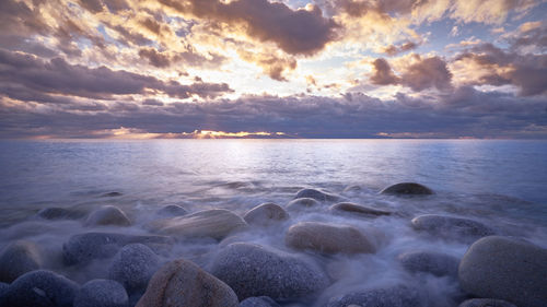 Scenic view of sea against dramatic sky