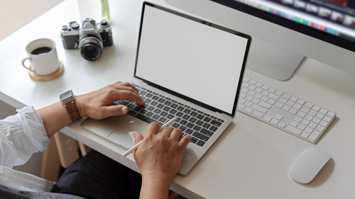 Cropped image of person working in office