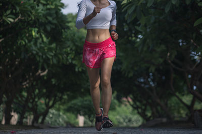 Midsection of woman standing outdoors