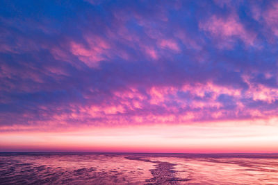 Scenic view of sea against sky at sunset