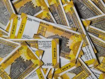 High angle view of yellow papers over white background