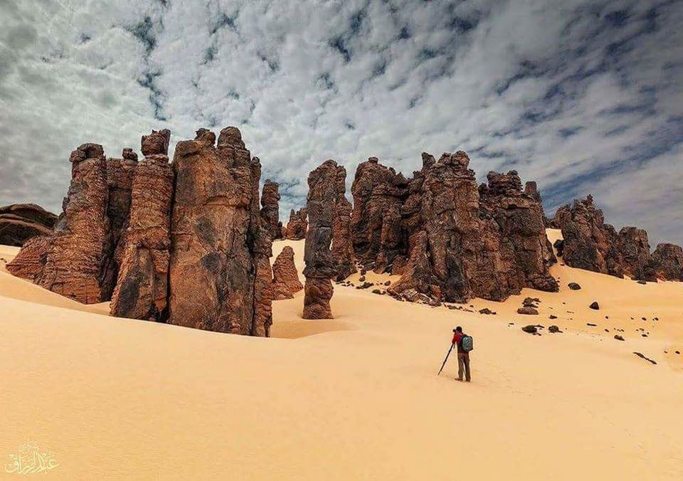 real people, rock, rock formation, sky, rock - object, beauty in nature, scenics - nature, leisure activity, cloud - sky, mountain, solid, lifestyles, nature, non-urban scene, people, environment, land, tranquil scene, landscape, adventure